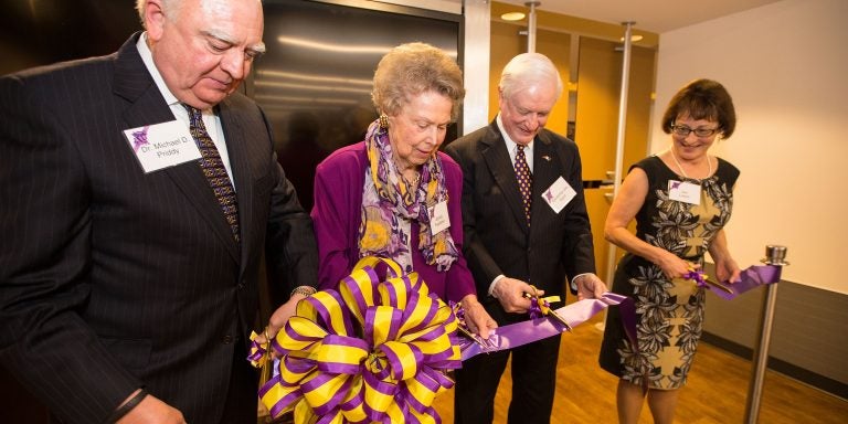 Janice Hardison Faulkner at the ribbon cutting for the Faulkner Gallery in 2014 with Michael Priddy, former state governor Jim Hunt and Jan Lewis, director of Joyner Library. Photo by Cliff Hollis.
