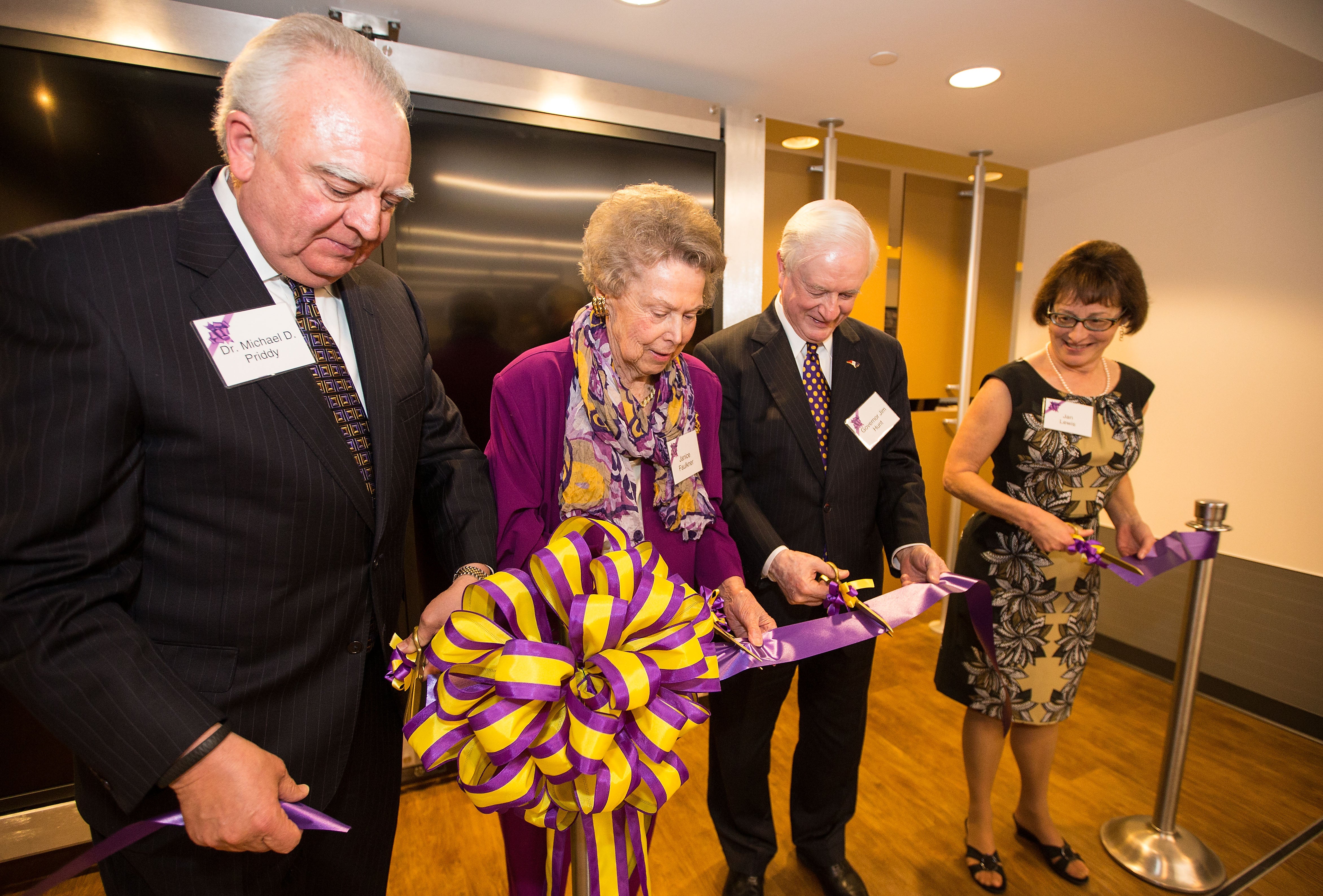 Janice Hardison Faulkner at the ribbon cutting for the Faulkner Gallery in 2014 with Michael Priddy, former state governor Jim Hunt and Jan Lewis, director of Joyner Library. Photo by Cliff Hollis.
