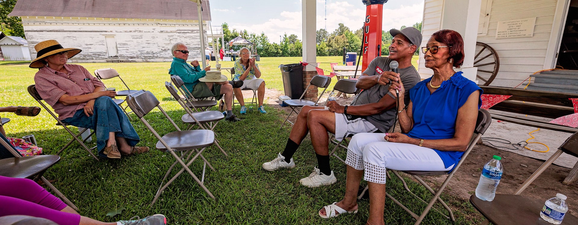 Dwight Hawkins, left, and Mamie Pritchard share memories of their family farm at the Juneteenth celebration at the Eastern Carolina Village and Farm Museum. 
(Photos by Cliff Hollis)