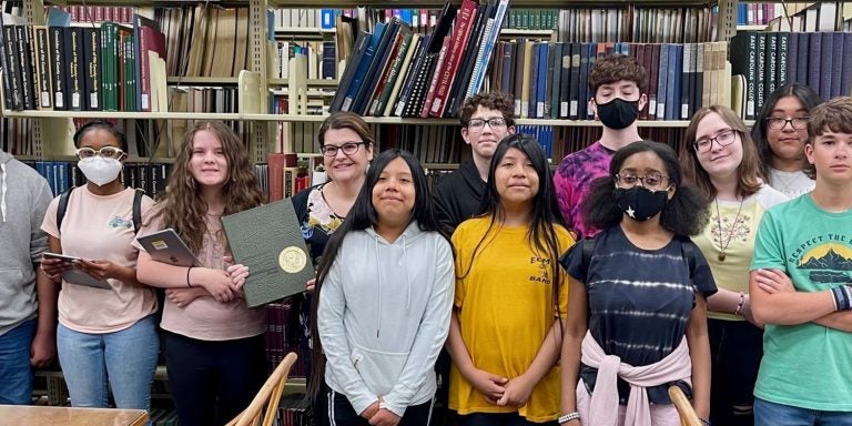 Students from Elizabeth City Middle School in April donated a copy of the 1969 East Carolina University yearbook to the ECU main campus library. (Photos by Ronnie Woodward)